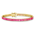 Gold tennis bracelet with pink lab-grown ruby rows and box clasp