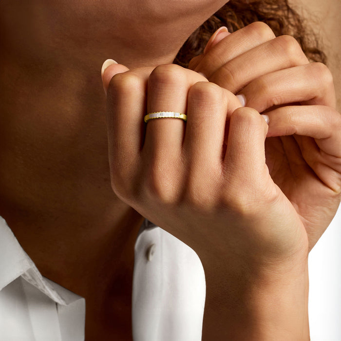 Baguette diamond ring on hand, gold band with rectangular lab-grown stones