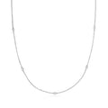 Sterling silver diamond station necklace with bezel-set round stones along the chain