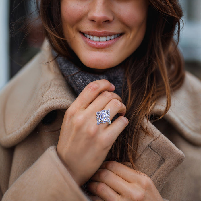 Sterling silver flower-burst ring with lavender oval stones, worn on finger