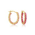 Gold hoop earrings with pink gemstones, inside-out bezel-set design