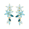 Floral drop earrings in gold-tone with light blue and dark blue marquise gemstones