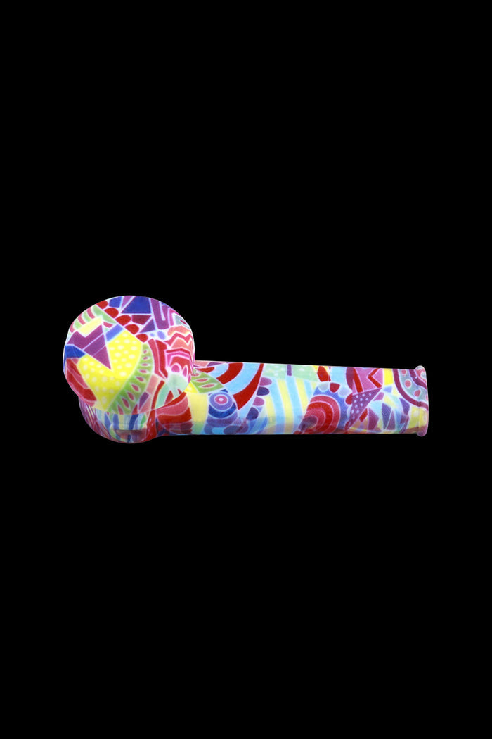 Colorful glass smoking pipe isolated on a black background.