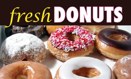 Fresh donuts with sprinkles, glaze, and powdered sugar for bakery signage