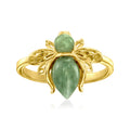 Gold-tone bee ring with two green jade cabochons on a slim band
