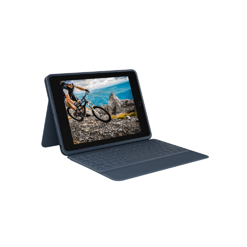 An iPad 7/8/9/10 in the Logitech Rugged Folio Blue case is displayed propped up with a mountain biker on screen, emphasizing its military-grade protection. Three-month warranty included.