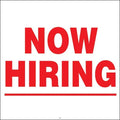 Now Hiring sign in bold red text on white background, ideal for storefronts and business advertising