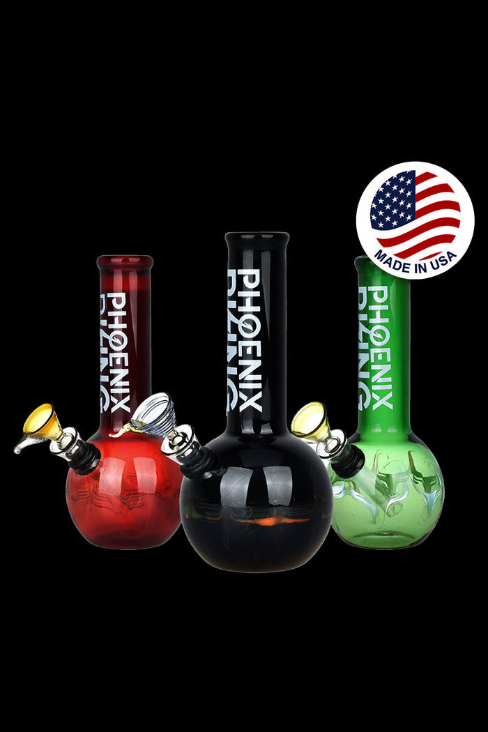 Three colorful glass bongs with “Phoenix” branding and a “Made in USA” seal against a black background.