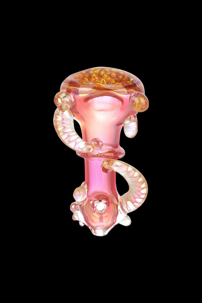 Pink glass cannabis pipe with intricate swirls and bubble details, isolated on a black background.