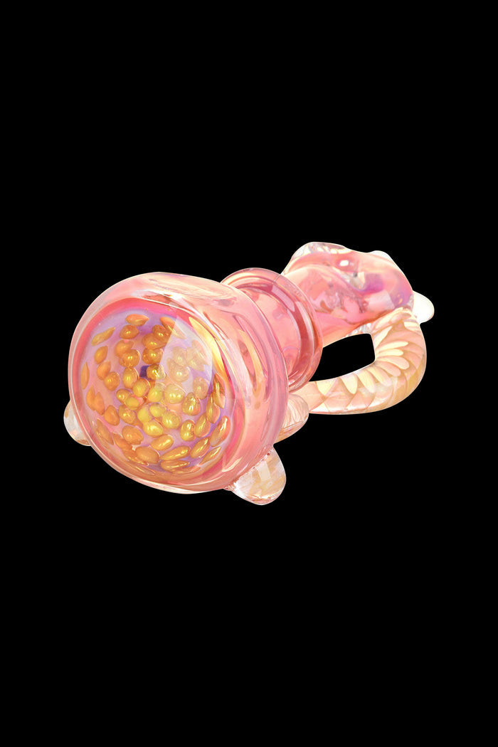 Pink glass cannabis pipe with textured bowl.