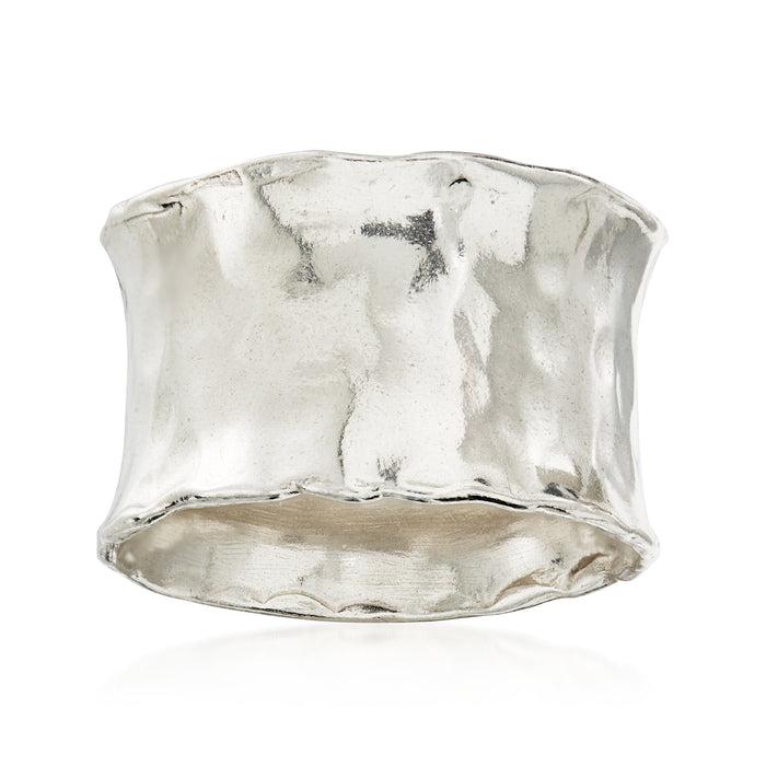 Hammered sterling silver ring, wide band with textured reflective finish.