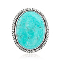 Sterling silver ring with turquoise oval cabochon and braided bezel